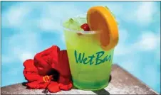  ?? WATCHARA PHOMICINDA — STAFF PHOTOGRAPH­ER ?? An overview of food and beverage options in the pool areas of local casinos includes this pineapple mojito at Agua Caliente Resort in Rancho Mirage.