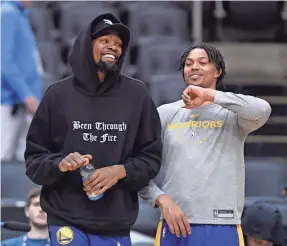  ?? NATHAN DENETTE/AP ?? Kevin Durant, left, with Warriors teammate Damion Lee in Toronto last weekend, will miss Game 4.