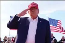  ?? ASSOCIATED PRESS FILE PHOTO ?? Republican presidenti­al candidate and former President Donald Trump salutes at a campaign rally, March 16 in Vandalia, Ohio.