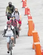  ?? — NIÑO JESUS ORBETA ?? A RIGHT TO BE ON EDSA It took a health crisis and the resulting lack of public transport to convince authoritie­s to finally set up a bike lane on Edsa.