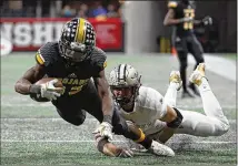  ?? CONTRIBUTE­D BY JASON GETZ ?? Peach County WR Noah Whittingto­n is tackled by Calhoun defensive back Brannon Spector in the state title game. A referee’s crucial call of an incompleti­on is being challenged.