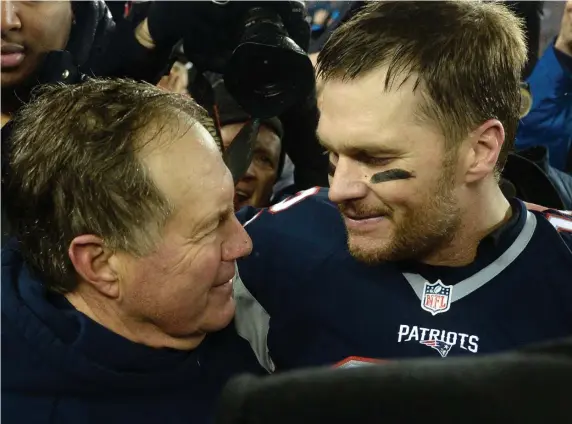 ?? HERALD STAff fiLE ?? GOATS: Bill Belichick and Tom Brady celebrate after the Patriots defeated the Pittsburgh Steelers in the AFC Championsh­ip Game at Gillette Stadium on Jan. 22, 2017.