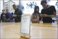  ?? Jeff Chiu / Associated Press ?? An iPhone 8 plus is shown on display at an Apple Store in San Francisco.