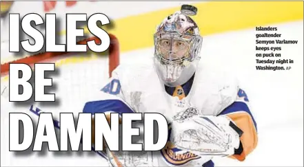  ?? AP ?? Islanders goaltender Semyon Varlamov keeps eyes on puck on Tuesday night in Washington.