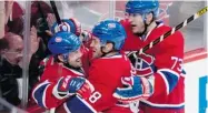  ?? PAUL CHIASSON/ THE CANADIAN PRESS ?? Brian Gionta, left, celebrates with Yannick Weber and Michael Ryder after his winning goal against the Lightning.