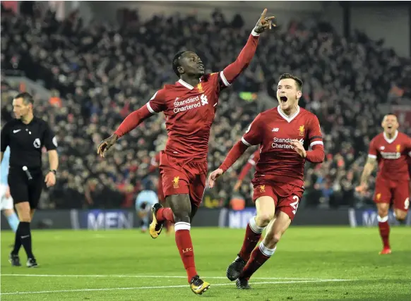  ?? Getty ?? Sadio Mane’s goal in the 61st minute, followed by Mohamed Salah’s, looked like overkill but Liverpool ended up needing both as Man City got within one at the finish