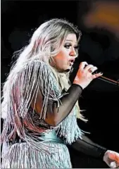  ?? DON EMMERT/GETTY-AFP ?? Kelly Clarkson performs last month in New York. The singer is getting her own daytime talk show next fall.