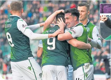  ??  ?? Hibs striker Marc McNulty celebrates his successful spot-kick with delighted team-mates