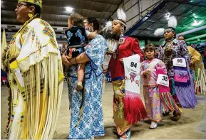  ?? QILING WANG / AMERICAN- ?? Dancers make their grand entrance Saturday at the Travis County Expo Center in Austin for the 26th annual Austin Powwow and American Indian Heritage Festival.
