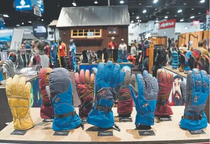  ?? Helen H. Richardson, Denver Post file ?? Gloves are on display at the Outdoor Retailer winter show last January in Denver. Many of the businesses are worried about the U.S. trade dispute with China. Rich Harper, the Outdoor Industry Associatio­n’s manager of internatio­nal trade, says some businesses estimate that every additional $1 in tariffs converts to an additional $4 in retail costs.