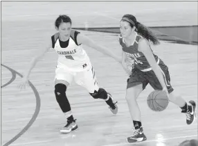  ?? MARK HUMPHREY ENTERPRISE-LEADER ?? Berryville senior Baylea Smith, shown dribbling against the man-to-man defense of Farmington’s Anthea Jones, has scored over 1,000 points in her career. The Lady Bobcats, who have reached the State 4A semifinals the last three years, are expected to contend for a 4A-1 Conference title.