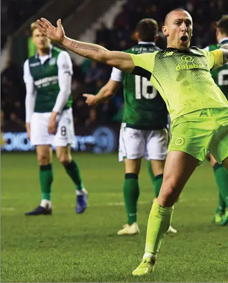  ??  ?? Delighted Celtic captain Scott Brown celebrates putting the Parkhead club 2-0 ahead against his former side Hibernian at Easter Road in typical ‘Broony’ fashion on Saturday evening