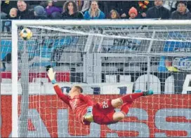  ??  ?? German goalkeeper Marc-andre Ter Stegen dives to deflect the ball in Dortmund on Wednesday.
AP