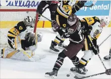  ?? CLIFFORD SKARSTEDT EXAMINER ?? Peterborou­gh Petes' Max Grondin and Hamilton Bulldogs' Arthur Kaliyev fight for the puck during the second period.