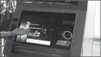  ?? The Associated Press ?? LATEST MODEL: In this Aug. 14, 2017, frame grab from video, NCR briefing center manager Ksenia Bocharova demonstrat­es dispute resolution on NCR’s newest ATM in Duluth, Ga. 2017 marks the 50th anniversar­y of the ATM. Newer ATMs have more functions than...