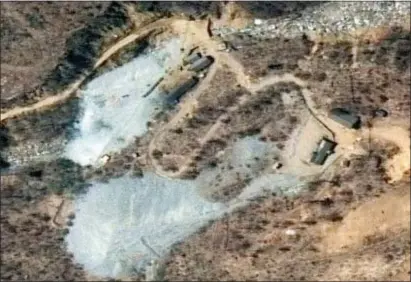  ?? MAXAR COMPANY VIA AP ?? This satellite image provided by DigitalGlo­be shows the nuclear test site in Punggye-ri, North Korea. Foreign journalist­s will journey into the mountains of North Korea this week to observe the closing of the country’s nuclear test site, a display of goodwill ahead of leader Kim Jong Un’s planned summit with President Donald Trump.