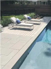  ?? PHOTOS COURTESY OF GROUPE PARAMOUNT ?? Combining wood and stone in backyard landscapin­g is becoming increasing­ly popular. This pool deck, for example, features concrete paving slabs with a polished finish adjacent to a section of Ipe wood that adds warmth and a rich organic texture and...