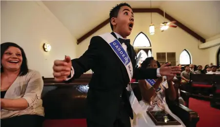  ?? Steve Gonzales / Houston Chronicle ?? Crespo Elementary School fourth-grader Nhedrick Jabier is thrilled to learn he won first place and a $1,000 prize in the 21st annual Martin Luther King Jr. Oratory Competitio­n on Friday at the historic Antioch Missionary Baptist Church.