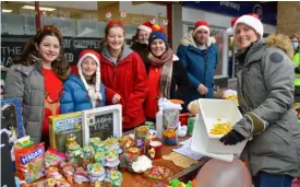  ?? ?? TREATS: The 1st. Woodley Scouts ran a tombola stall to fundraise for the group