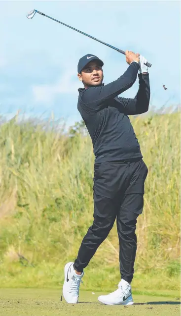  ??  ?? ROLLERCOAS­TER ROUND: Jason Day hits his tee shot on the 12th hole during the first round of the British Open at Royal Birkdale. The Queensland­er’s fashion choices caused a stir. Picture: GETTY