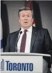  ?? CHRISTOPHE­R KATSAROV THE CANADIAN PRESS ?? Toronto Mayor John Tory is not happy with Ontario Premier Doug ford’s plan to cut city council.