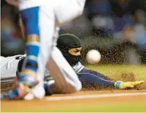  ?? CHICAGO TRIBUNE FILE ?? Wander Franco slides safely into third base as he advances on a fly ball against the Cubs at Wrigley Field.