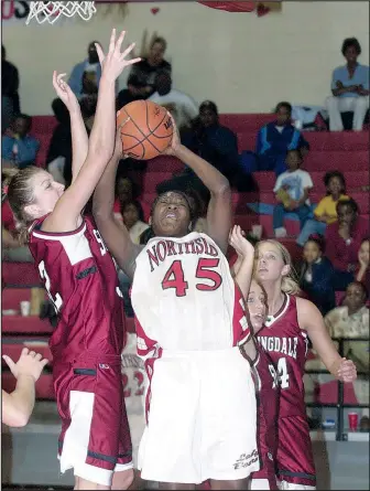  ?? File Photo/Arkansas Democrat-Gazette ?? Fort Smith Northside’s Tamika Kursh (45) is fouled by Springdale’s Benita Gregory during