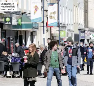  ??  ?? Shoppers in Huddersfie­ld town centre