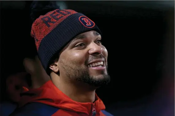  ?? MATT STONE — BOSTON HERALD ?? Xander Bogaerts smiles in the dugout during the eighth inning of an Oct. 3 game against the Tampa Bay Rays in Boston. He was likely also smiling when free agency began.