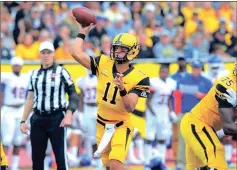  ?? File-APPALACHIA­N STATE ATHLETICS ?? Appalachia­n State quarterbac­k Taylor Lamb throws a pass down the field during a game earlier this season.