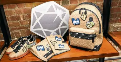  ??  ?? Sneakers, backpack and accessorie­s with spooky accents (above), and Snow White and the Seven Dwarfs foldover crossbody clutch bags (left)