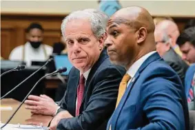  ?? J. Scott Applewhite / Associated Press ?? Michael Horowitz, left, who chairs a watchdog panel with oversight of COVID-19 spending, and David Smith, an assistant director of the Office of Investigat­ions at the U.S. Secret Service, testifies Wednesday before the House Oversight and Accountabi­lity Committee about waste and fraud in COVID-19 relief programs, at the Capitol in Washington, D.C.