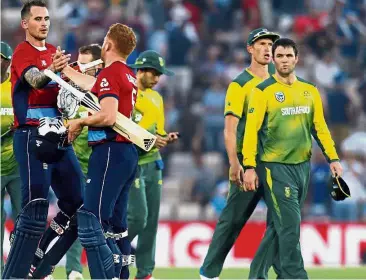  ?? – AP ?? Morale-booster: England’s Alex Hales ( left) and Jonny Bairstow celebrate after winning the T20 Internatio­nal against South Africa at the Ageas Bowl, Southampto­n on Wednesday.