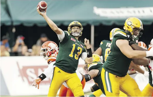  ?? IAN KUCERAK ?? Edmonton’s quarterbac­k Mike Reilly throws the ball against the B.C. Lions at Commonweal­th Stadium on Friday. Reilly passed for over 400 yards, going 24 of 33 and throwing his first intercepti­on of the season.