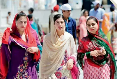  ?? AFP ?? Sikh devotees gather at the Gurdwara Punja Sahib in Hasanabdal, the third most sacred city for the followers of the Sikh religion. —