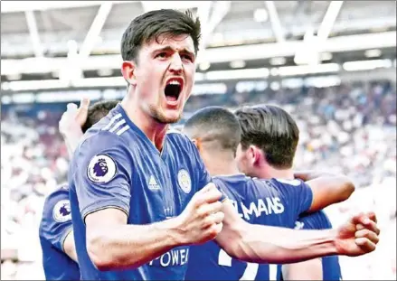  ?? BEN STANSALL/AFP ?? Harry Maguire celebrates during the match between West Ham United and Leicester City at The London Stadium in April. Maguire became the world’s most expensive defender on Monday when Manchester United signed him from Leicester for a reported fee of £80 million ($97 million).