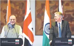  ??  ?? British chancellor Philip Hammond (right) and Indian Finance Minister Arun Jaitley take part in a joint press conference in New Delhi. Brexit will likely lead to a “far higher level of engagement” with Britain, India’s finance minister said during a...