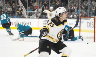  ?? Ben Margot / Associated Press ?? Boston’s Charlie McAvoy celebrates after scoring the game-winning goal. The win was the sixth in a row for the Bruins, who have the second-best record in the Eastern Conference.