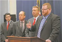  ?? SUSAN MONTOYA BRYAN THE ASSOCIATED PRESS ?? John Suggs, 12th Judicial District attorney, right, and other members of the New Mexico District Attorneys’ Associatio­n discuss proposed changes to the state’s bail reform rules Thursday in Albuquerqu­e. At left is Marco Serna, the First Judicial...