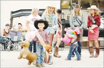  ?? MARK HUMPHREY ENTERPRISE-LEADER ?? Porter “Gauge” Perkins, 3-year-old son of Charlie and Christy Perkins, of Farmington, emerged from the 2019 Lincoln Riding Club Little Mister contest with the title and two handsful of horses. Chloie Thomas, 2018 LRC princess, was available to assist Gauge, but the junior cowboy had no problems handling the horses. See more rodeo stories and photos in the Sports section.