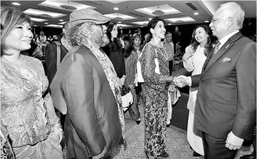  ??  ?? Najib (right) shares a light moment with arts activists after launching the Cultural Economy Developmen­t Agency (Cendana) at the Perdana Putra building. — Bernama photo