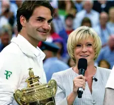  ?? ?? At work: With winner Roger Federer in 2012