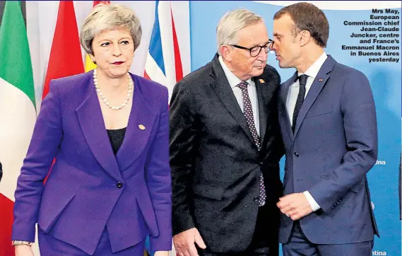  ??  ?? Mrs May, European Commission chief Jean-Claude Juncker, centre and France’s Emmanuel Macron in Buenos Aires yesterday