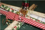  ?? DIGITAL FIRST MEDIA FILE PHOTO ?? Gift wrapping paper and ribbons are displayed. Use this Black Friday to get a jump on Christmas shopping for gifts that promote wellness.