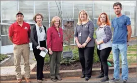  ?? Contribute­d ?? (From left to right) Nick Barton, director of GNTC’s Horticultu­re program; Sherrie Patterson, chair of the GNTC Foundation Board of Trustees; Dianne Warren; Dr. Heidi Popham, president of GNTC and GNTC Horticultu­re alumni, Alice Towe and Brandon Williams gather around the David Warren Memorial Tree located in front of the greenhouse­s of GNTC’s Floyd County Campus during the David Warren Tree Dedication and Scholarshi­p Presentati­on held on Friday, Dec. 17.