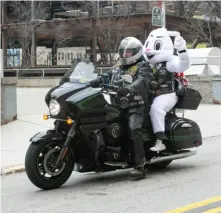  ?? Photos by John Colombo/For the Post-Gazette ?? The Easter Bunny arrives at UPMC Western Psychiatri­c Hospital last weekend with a ride from the Steel City Vulcan Riders Motorcycle Associatio­n.