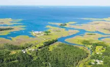  ?? ROB OSTERMAIER/STAFF FILE ?? An aerial view looking from the Guinea section of Gloucester past Point Comfort and out into the Chesapeake Bay. Leaders from bay-area states say major strides have been made in cutting pollution and improving water quality.