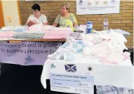  ??  ?? Knitting hope Marjory Daly’s stall at Monklands Hospital with beautifull­y knitted items