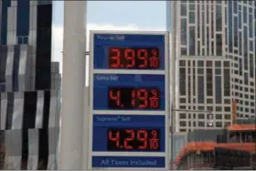  ?? MARK LENNIHAN — THE ASSOCIATED PRESS FILE ?? Gas prices are displayed at a Mobil station in New York. Crude oil prices are at the highest level in more than three years and expected to climb higher, pushing up gasoline prices along the way.