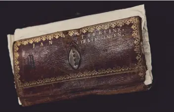  ?? ?? The wallet of a Dutch merchant, his name embossed on the leather, that was aboard a ship captured by the British at the start of the Napoleonic Wars.